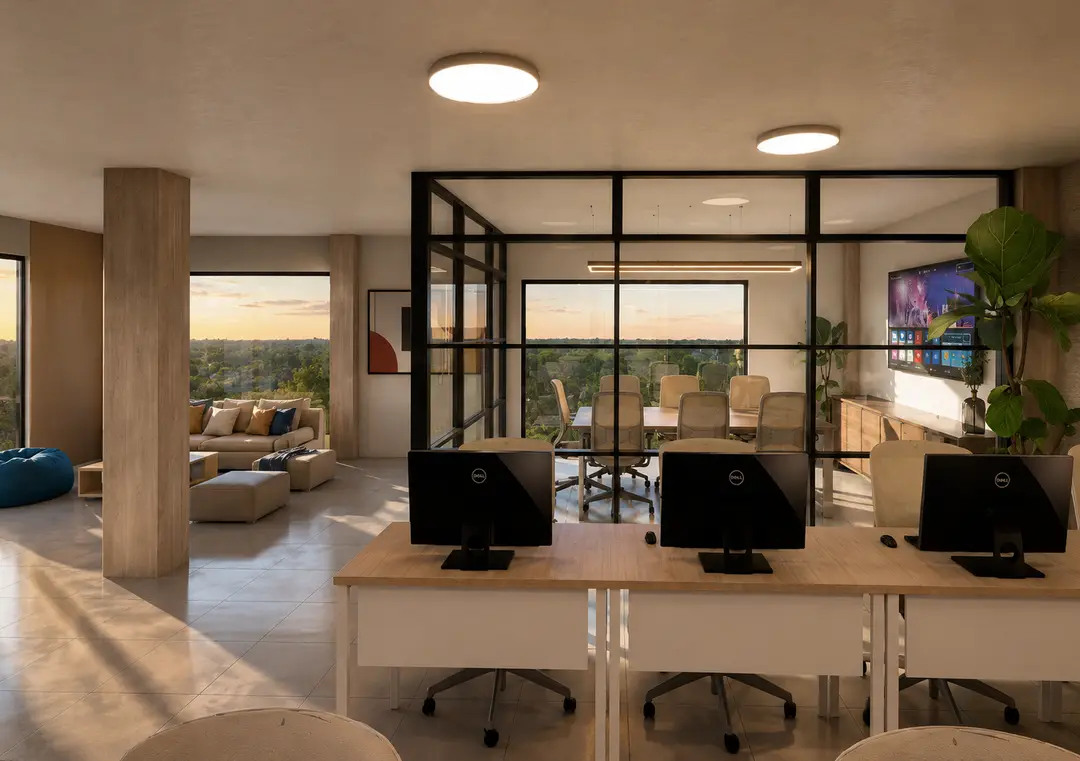 Coworking de Embassy Gardens con estaciones de trabajo, sala de reuniones acristalada y vista al verde